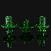 710 Pipes Smoke Shop W.C. Stearns transparent green glass spinner caps with gold dichro and coral-style attachments.