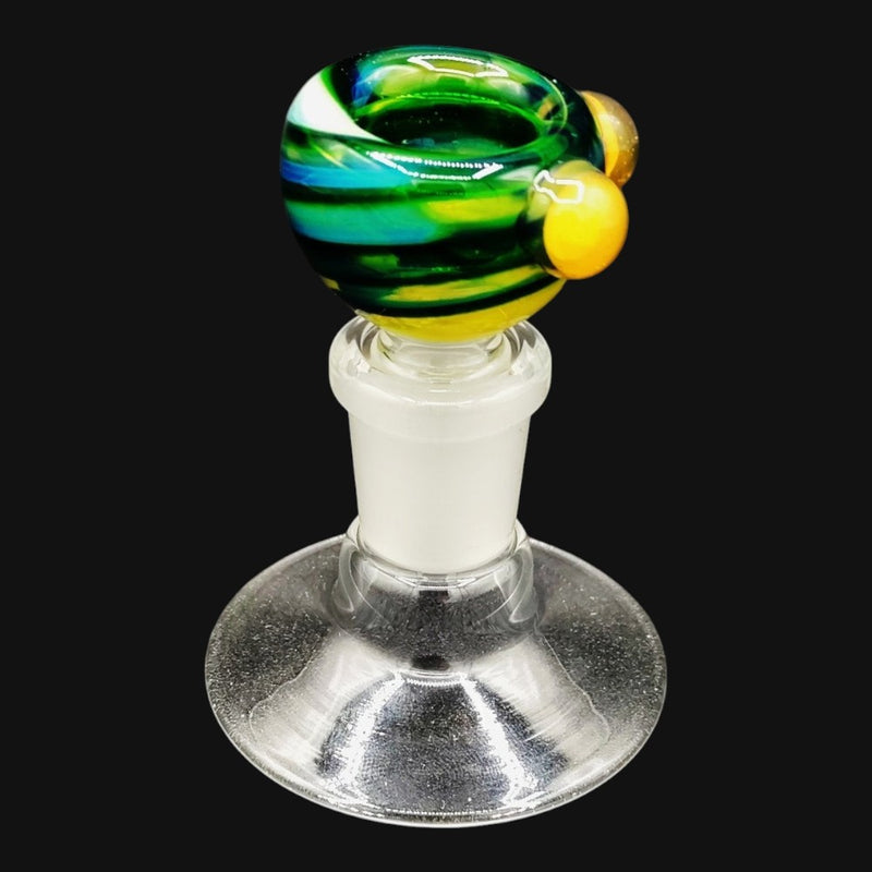 710 Pipes Smoke Shop Westie glass 14mm bowl slide featuring a green, blue, and yellow swirl design with yellow beads.