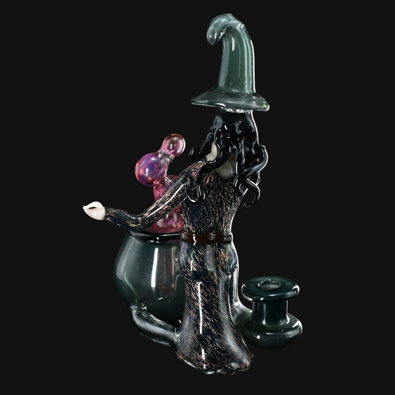 710 Pipes Smoke Shop Rich Villa "Witches Get Stoned" glass recycler rig with witch figure, cauldron, and pink orb.