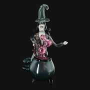 710 Pipes Smoke Shop Rich Villa "Witches Get Stoned" glass recycler rig featuring a witch figure over a cauldron, pink bubblers, and a green witch hat.