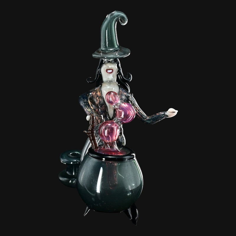 710 Pipes Smoke Shop Rich Villa "Witches Get Stoned" glass recycler rig featuring a witch figure over a cauldron, pink bubblers, and a green witch hat.