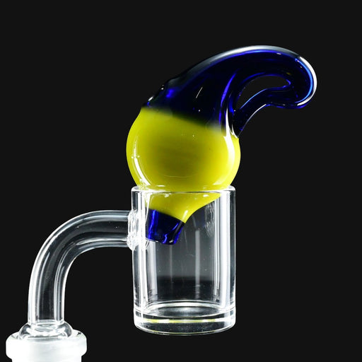 710 Pipes Smoke Shop Liquid Glass Works carb cap featuring a vibrant yellow and deep blue glass design on a clear banger