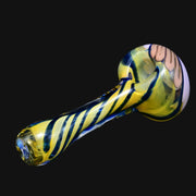 710 Pipes Smoke Shop glass spoon pipe featuring a yellow and blue twisty spiral pattern with a white accent bowl