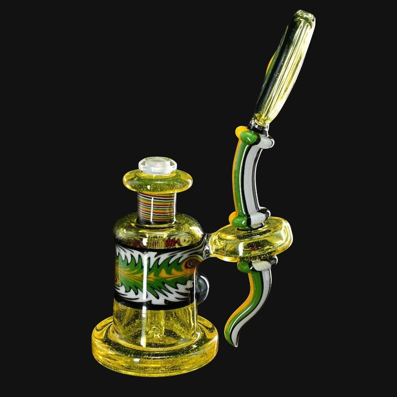 710 Pipes Smoke Shop yellow glass dab rig with green and white accents, featuring a removable down-stem and colorful banded neck.