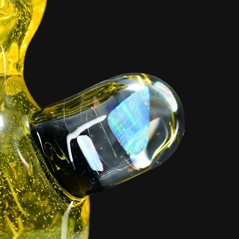 710 Pipes Smoke Shop yellow glass donut rig with blue opal accents and a donut mouthpiece.