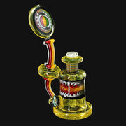 710 Pipes Smoke Shop yellow glass rig with red, yellow, and white accents and a flame design.
