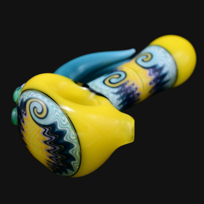 710 Pipes Smoke Shop yellow glass spoon pipe with blue accents and wig wag pattern
