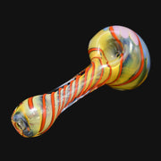 710 Pipes Smoke Shop glass spoon pipe featuring a yellow base with orange twisty glass accents and a front carb
