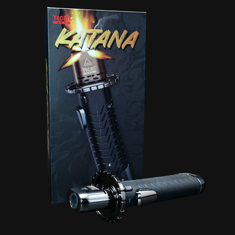 710 Pipes Smoke Shop Yocan Katana torch with ergonomic black handle and adjustable flame control in front of packaging