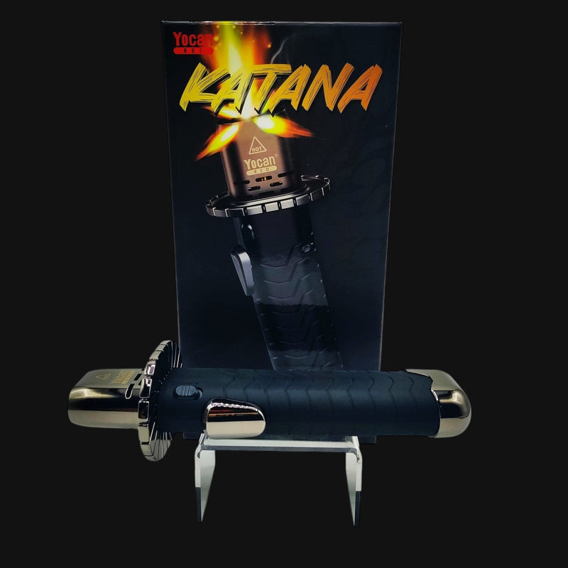710 Pipes Smoke Shop Yocan Katana butane torch with ergonomic black grip and safety lock in front of product packaging