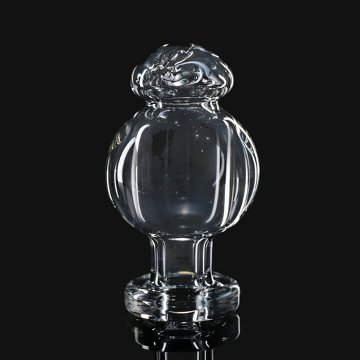 710 Pipes Smoke Shop clear glass Zombie Hand Spinner Bubble Cap for dabbing with a rounded top and ribbed design.
