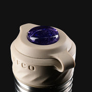 710 Pipes Smoke Shop Zombie Hands Studios Peak Pro oculus cap with a tan silicone base and deep purple glass insert.