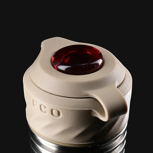 710 Pipes Smoke Shop Zombie Hands Studios Peak Pro oculus cap in tan silicone with a deep red glass accent.