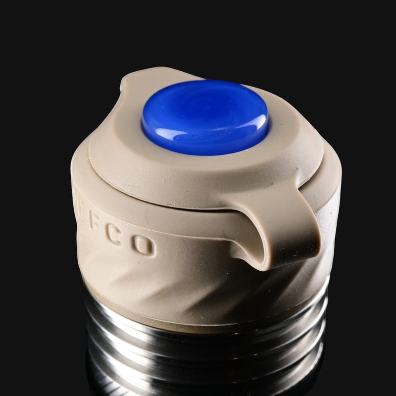 710 Pipes Smoke Shop Zombie Hands Studios Peak Pro oculus cap in tan with a blue glass topper on a black background.