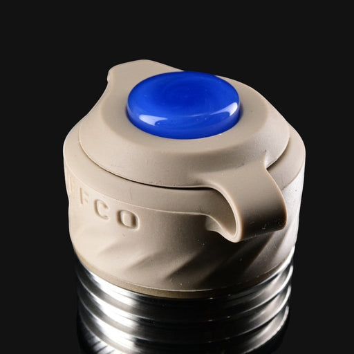 710 Pipes Smoke Shop Zombie Hands Studios Peak Pro oculus cap in tan with a blue glass topper on a black background.