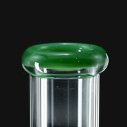 710 Pipes Smoke Shop close up view of Color Lip Beaker 50 water pipe featuring a clear glass neck with a vibrant green glass rim.