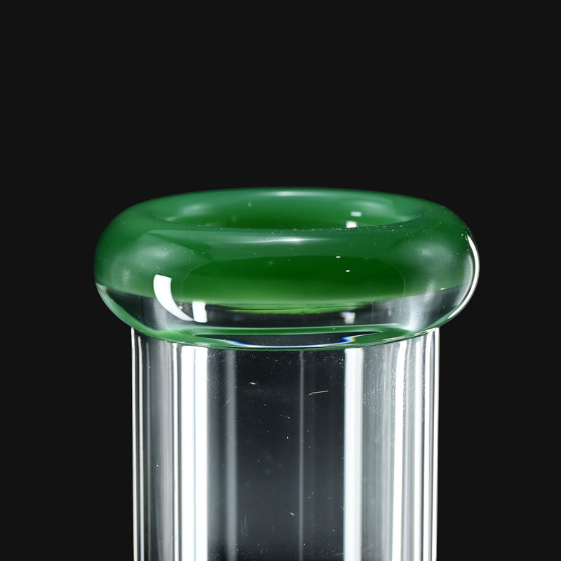 710 Pipes Smoke Shop close up view of Color Lip Beaker 50 water pipe featuring a clear glass neck with a vibrant green glass rim.