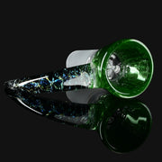 lay down view of Kadabra 14mm Slide bowl in the color of Green Stardust for smoking