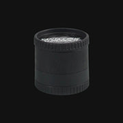 Black Santa Cruz ECO hemp-based herb grinder from 710 Pipes Smoke Shop with textured grip edges.