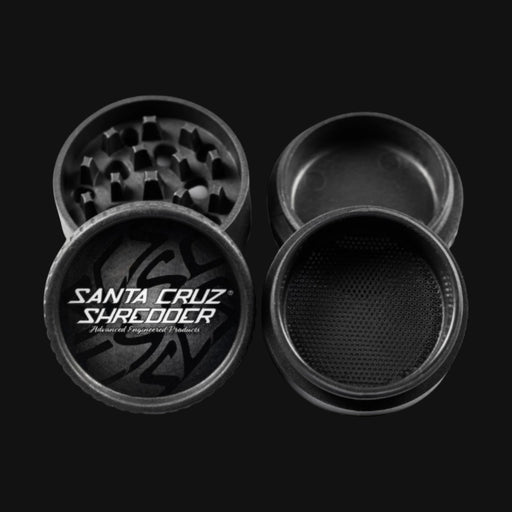 Black hemp-based Santa Cruz ECO Grinder from 710 Pipes Smoke Shop featuring a multi-piece design with sharp teeth.