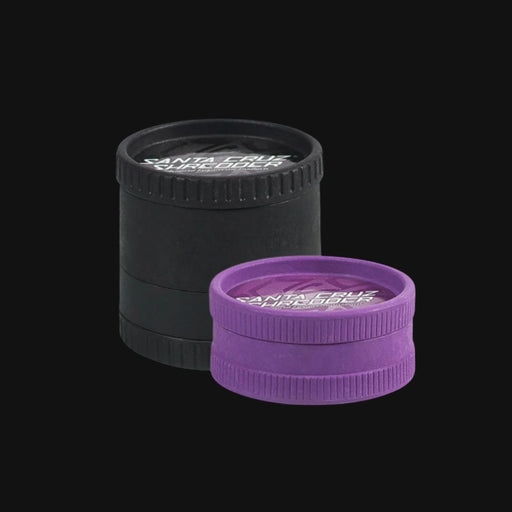 710 Pipes Smoke Shop Santa Cruz ECO hemp bud grinders in black and purple with textured grip edges.
