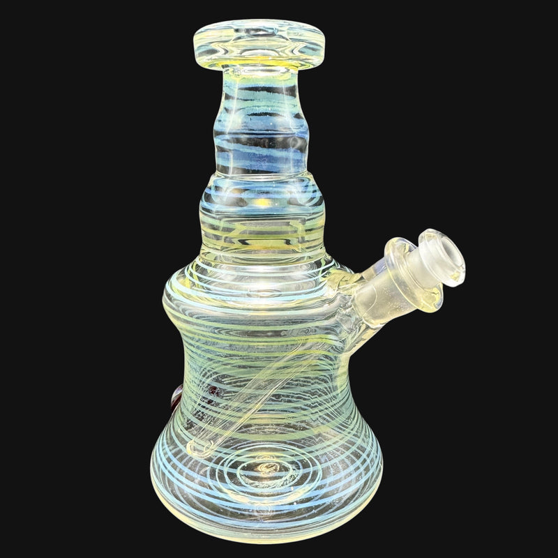 710 Pipes Smoke Shop Spore Print glass fume rig featuring blue and yellow swirling glass patterns.