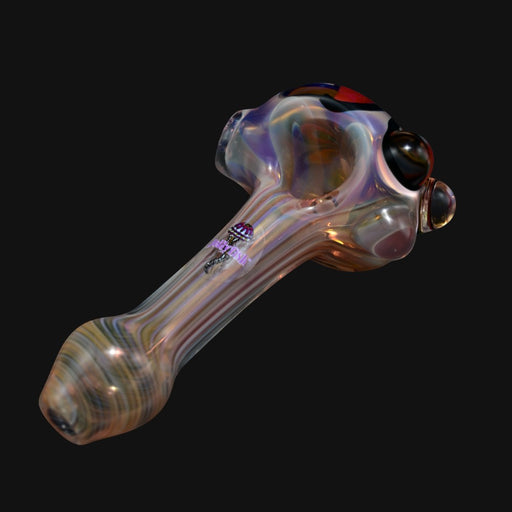 Jellyfish glass spoon pipe with iridescent swirl patterns and floral accents on a black background