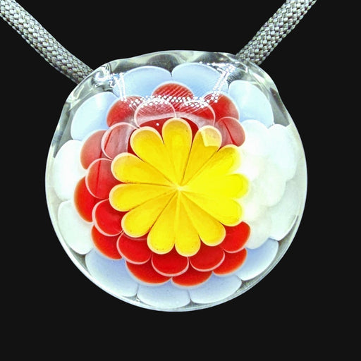 Matsumura glass pendant featuring a colorful yellow and red dot stack design on a grey cord.