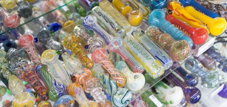 Case full of many colorful glass pipes for sale