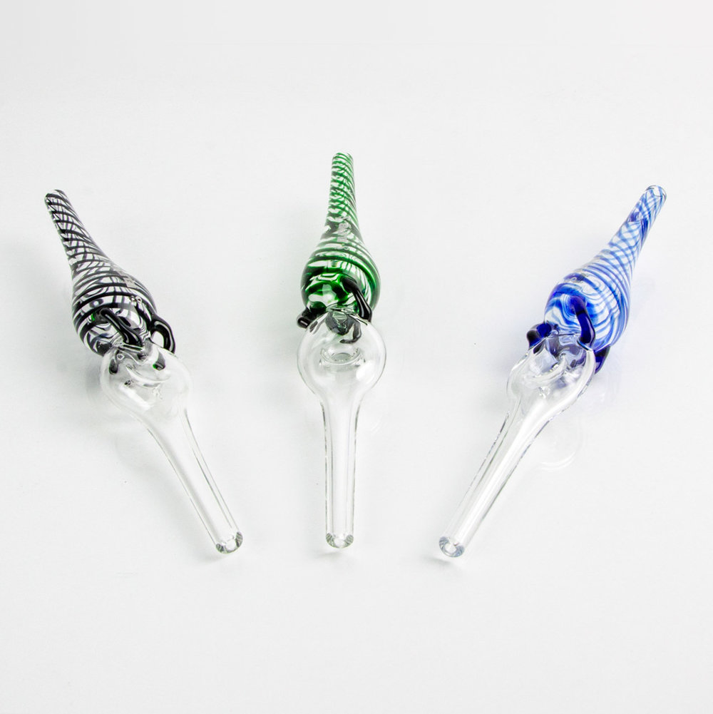 Three adjacent heady glass dab straws on white surface in assorted colors