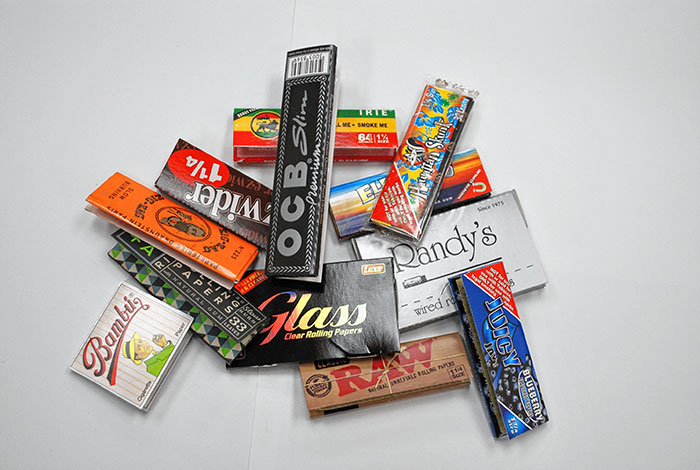 Rolling paper packages from top brands like OCB and RAW