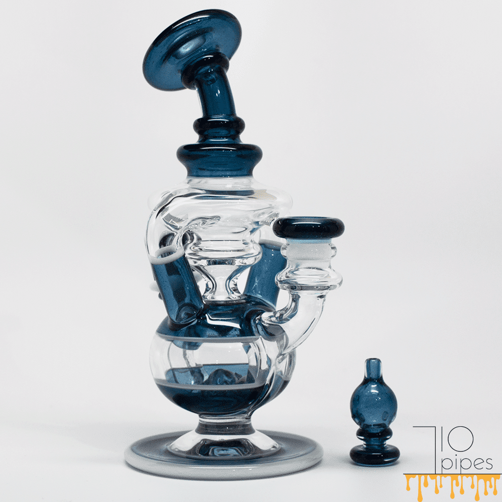 Blue accented glass recycler bong with a matching blue accessory