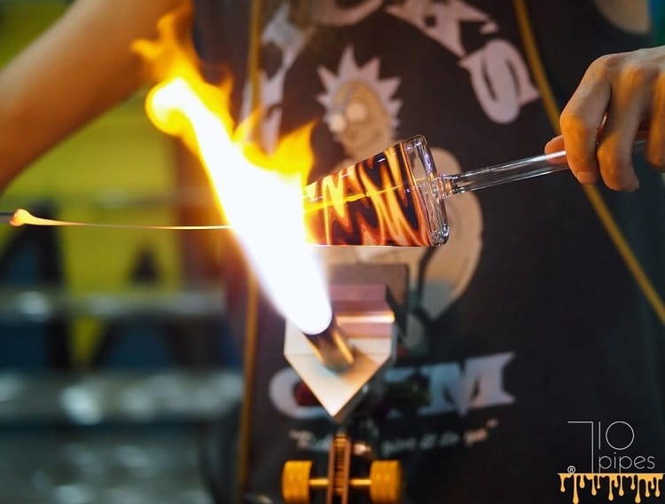 Denver glassblower Chris Bearden using blowtorch to create heady glass at 710 Studios in Northglenn, CO