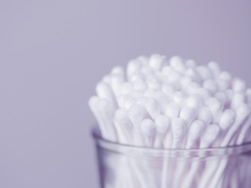 Q-tips in clear plastic container