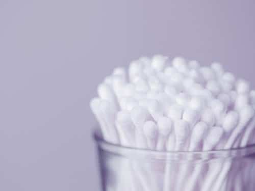 Q-tips in clear plastic container
