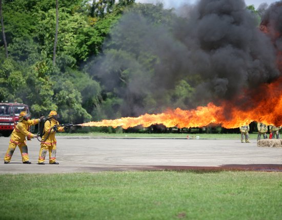 2 firefighters with a flamethrower