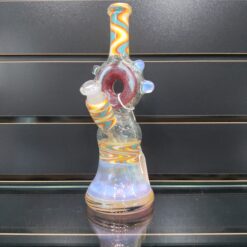 HeavyDirty x 710 Pipes collab dab rig with opal accents, shown on display