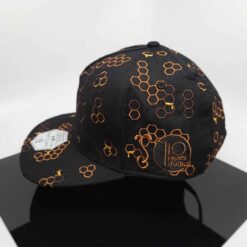 710 Studios x Grassroots snapback hat in black with gold hexagon pattern