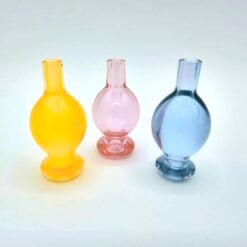 Kadabra Color Bubble Cap shown in three colors, yellow, pink and blue