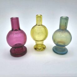 Cajun Glass color bubble caps shown in magenta, yellow and blue