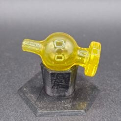 Zombie Hand color bubble cap in yellow glass on a display stand