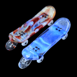 Burning Bush skateboard deck glass pendants shown in red and blue