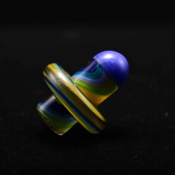 Charisma slurper spinner carb cap number 5 in blue and yellow, angled view