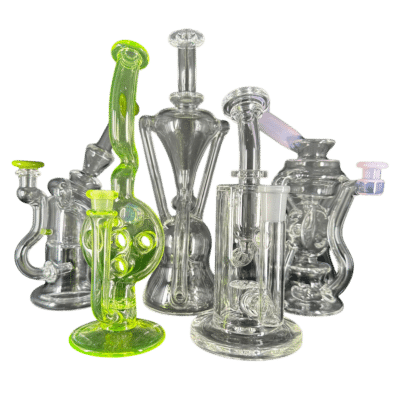 Assortment of glass dab rigs including a green recycler and clear percolator rigs