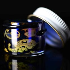 Empty1 Laser Micro Jar number 4 in cobalt blue and gold, angled view with lid off