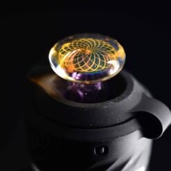 Gatez Glass 3DXL joystick cap number 2 in gold and purple, attached to the Peak Pro