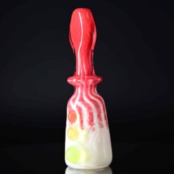 Goblin King red and white glass chillum with marble accents, standing upright