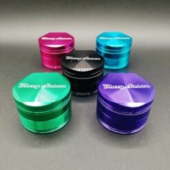 Blazy Susan 4-piece grinders shown in pink, teal, black and purple