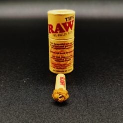 RAW Pre-Rolled Rose Tip in tube packaging, rose-shaped filter tip visible