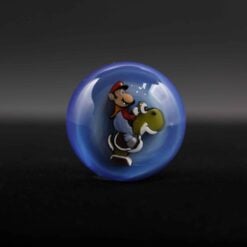 Micro's Workshop Slurper Marbles, blue glass marble with a Mario character design